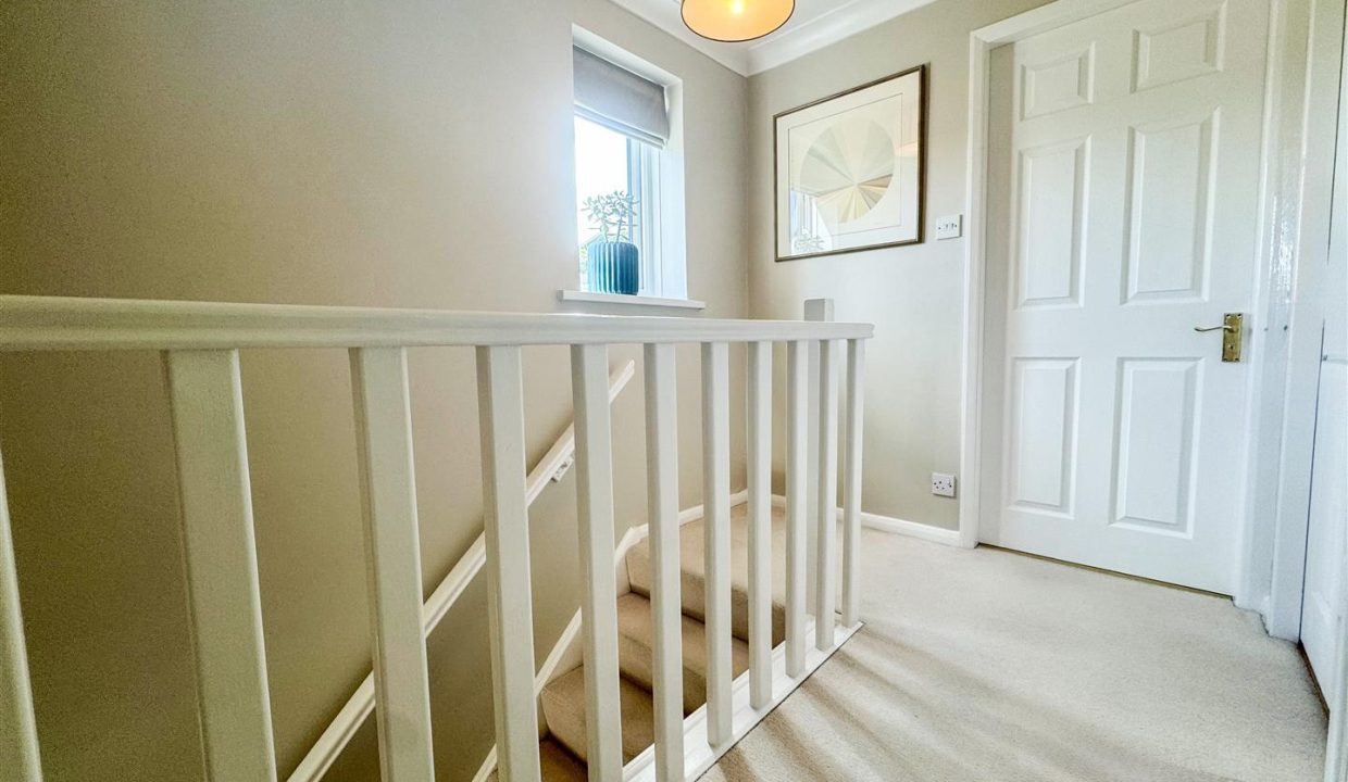 STAIRS RISING TO THE SECOND FLOOR LANDING