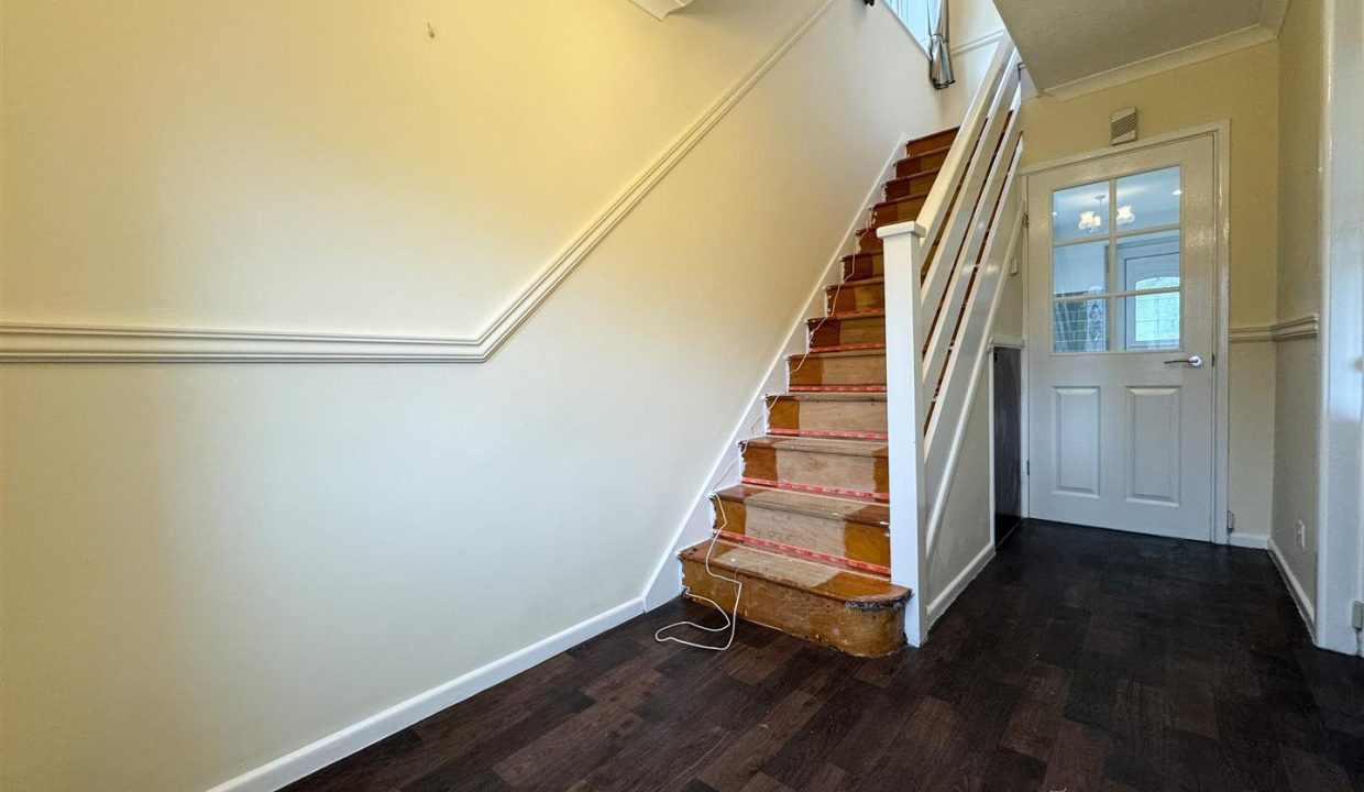 STAIRS RISING TO THE FIRST FLOOR