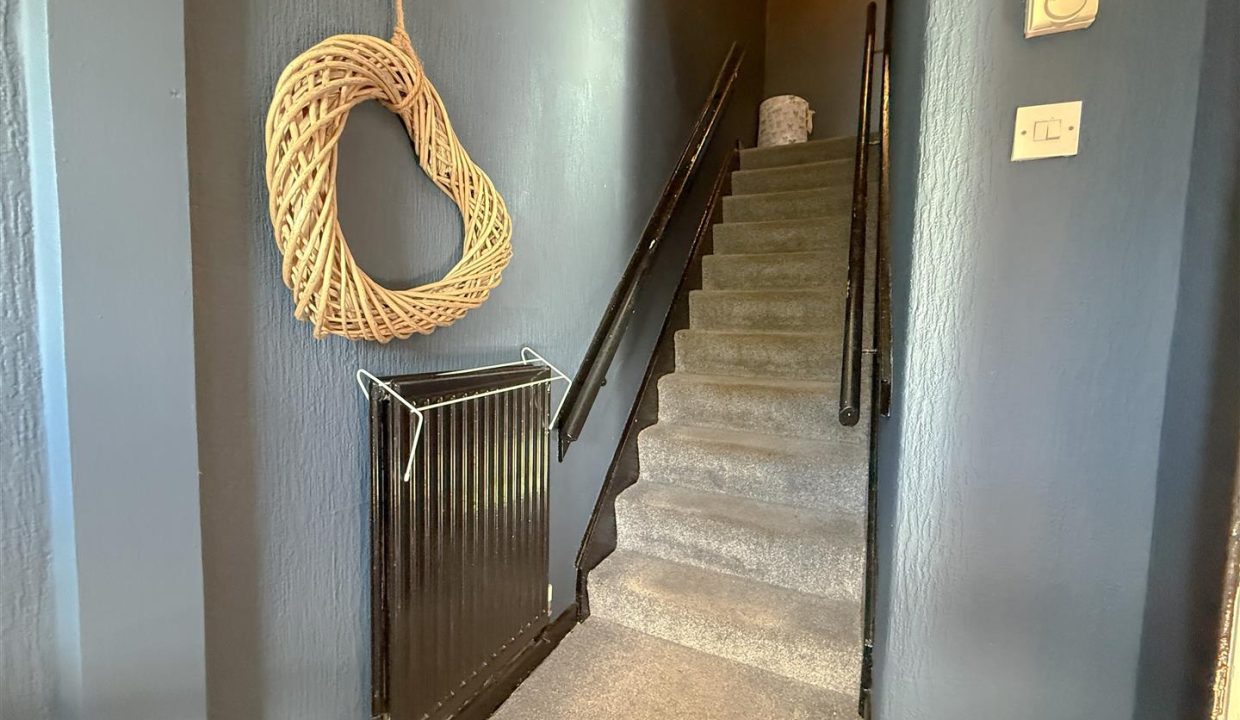 STAIRS RISING TO THE FIRST FLOOR