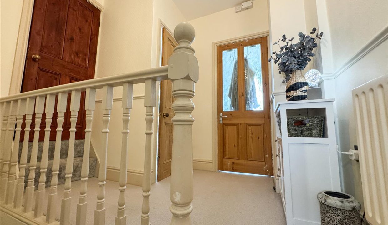 STAIRS RISING TO THE SECOND FLOOR